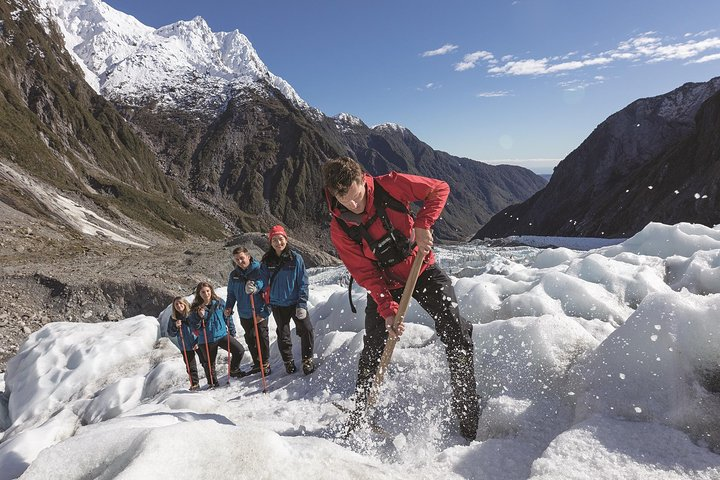 Navigate the stunning glaciers of New Zealand's South Island where adventure meets breathtaking scenery. Experience the joy of exploring icy landscapes and majestic mountains with fellow travelers.